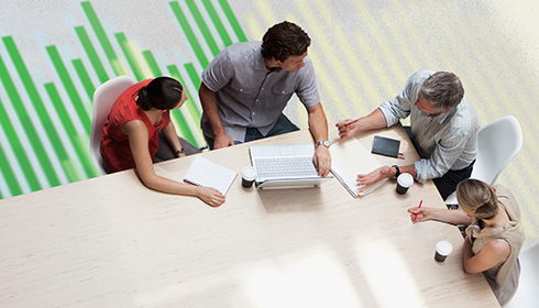workers around a meeting table