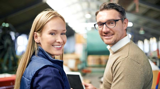 Cropped shot of a two coworkers managing a warehouse