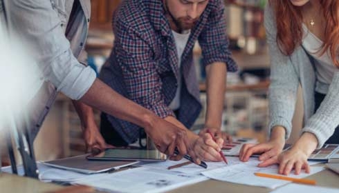 Close up of a coworkers working on a project