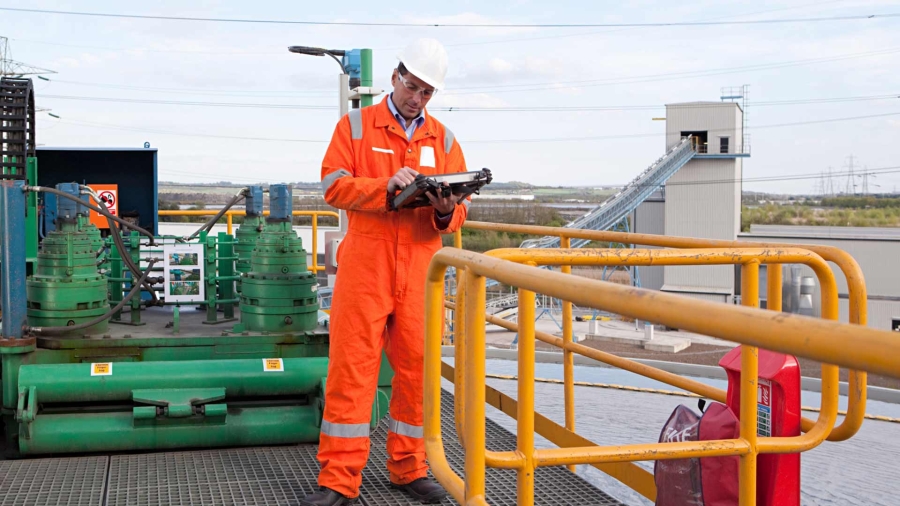 Engineer at a site with a tablet in hand